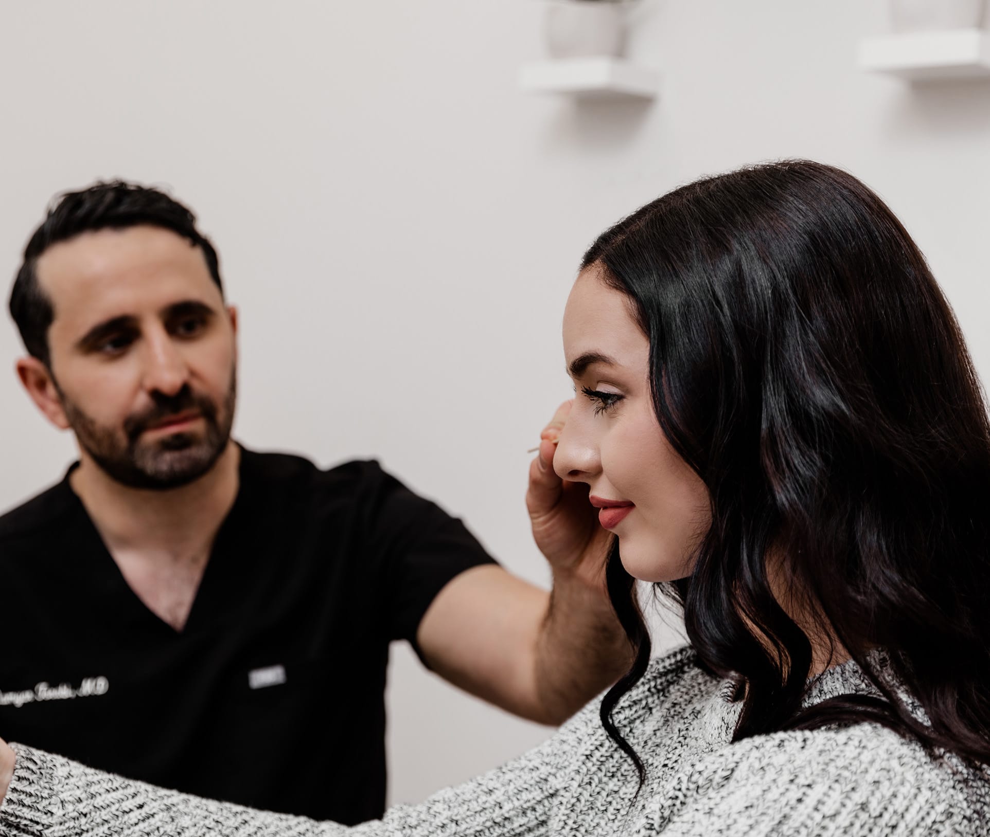 doctor pointing to patient's face