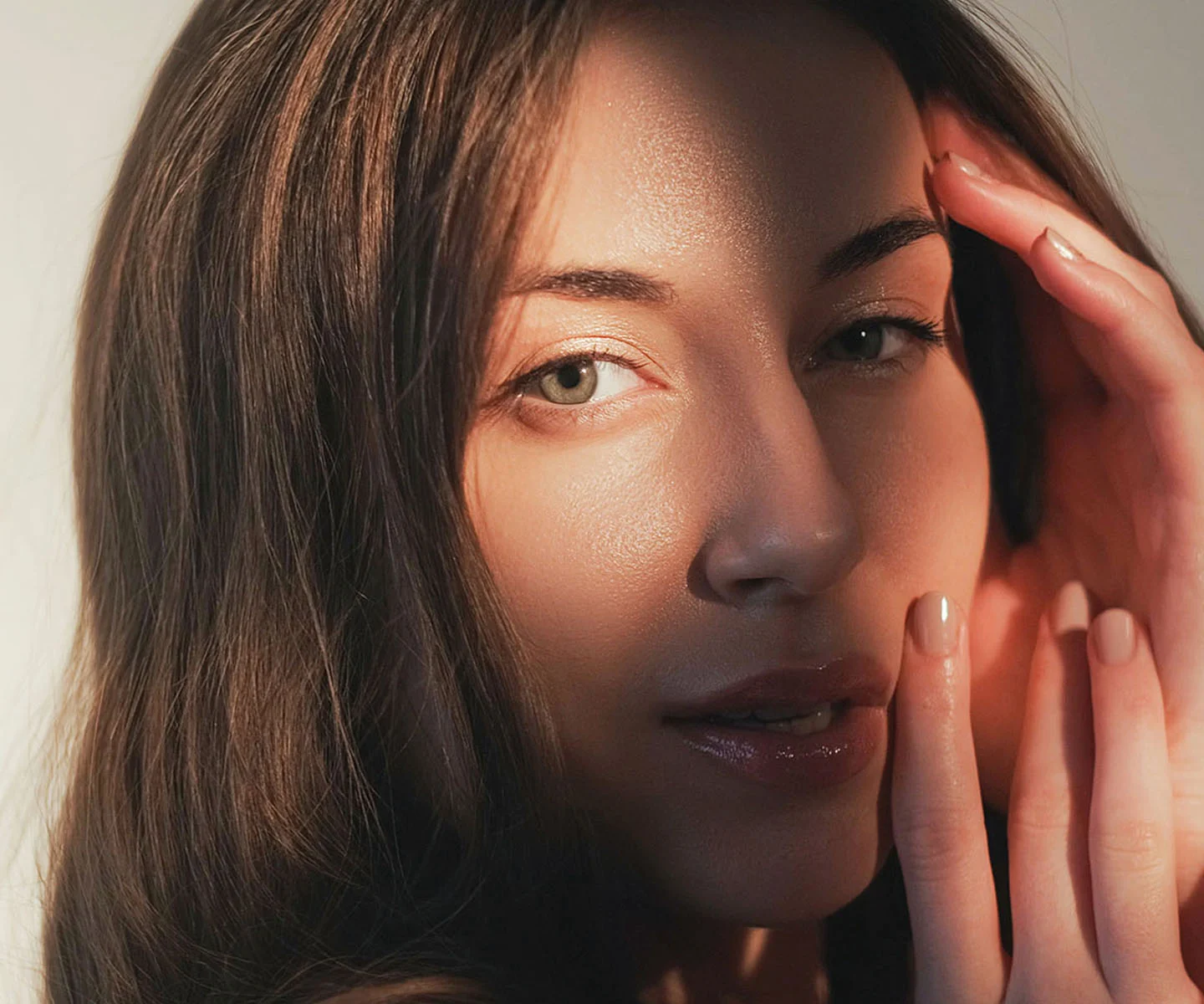 An extreme close-up of a person’s eye and upper cheek. The eye is clear and bright, looking slightly upward. The lighting is sharp and detailed, highlighting the texture of the iris and the individual eyelashes. The skin around the eye is smooth and well-lit, with a focus on clarity and medical-grade precision. The background is a neutral, out-of-focus grey. - Blocked tear duct in Arizona