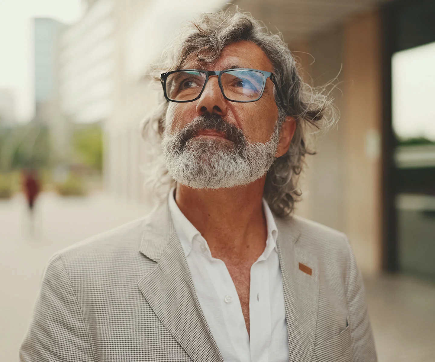 A professional and serene close-up focusing on the upper half of a woman’s face. Her eyes are closed, and the lighting is very soft and diffused, minimizing shadows and emphasizing the smooth, calm surface of the eyelids and brow area. The background is a pale, neutral tone that maintains a clinical yet gentle and compassionate feel. - Eye removal in Arizona